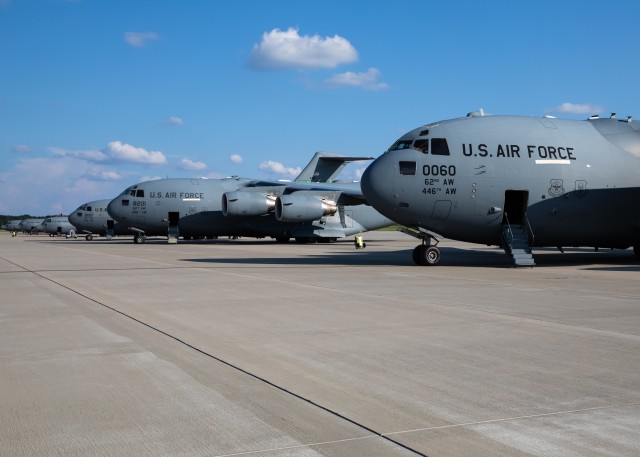 U.S. Air Force C-17 Globemaster IIIs and C-130s wait for Paratroopers to load during Exercise Panther Storm at Green Ramp on Fort Bragg, N.C., August 11, 2020. Panther Storm is a brigade-level training exercise designed to sharpen Paratroopers ability to deploy anywhere in the world within 18 hours, fight and win against U.S. adversaries.