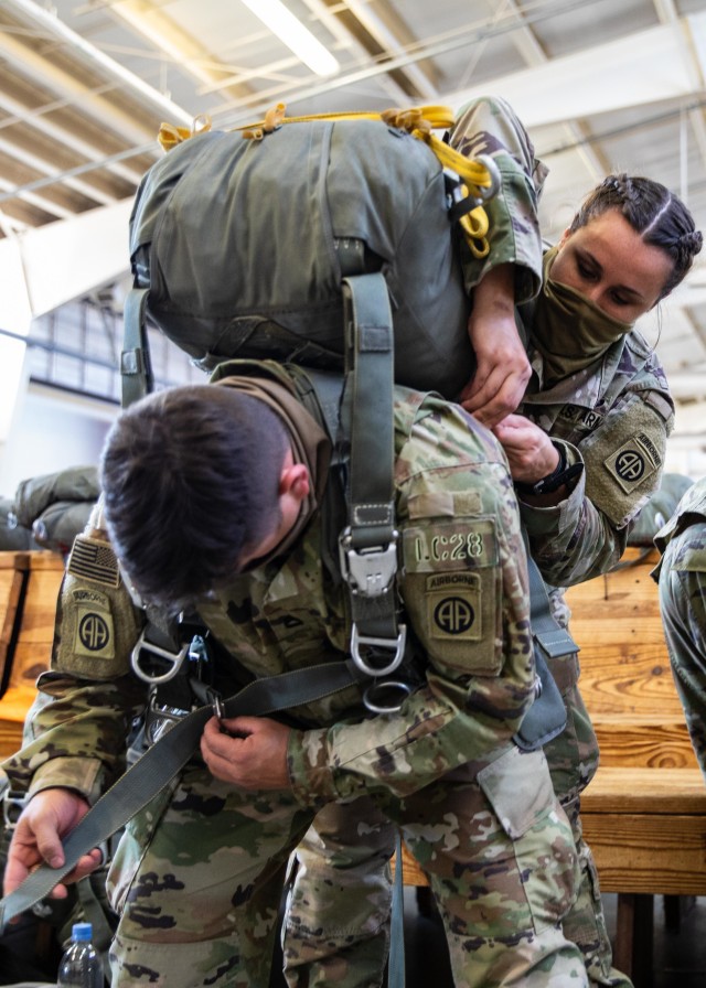 Paratroopers assigned to 3rd Brigade Combat Team, 82nd Airborne Division don their T-11 parachutes during Exercise Panther Storm at Green Ramp on Fort Bragg, N.C., August 11, 2020. Panther Storm is a brigade-level training exercise designed to sharpen Paratroopers ability to deploy anywhere in the world within 18 hours, fight and win against U.S. adversaries.