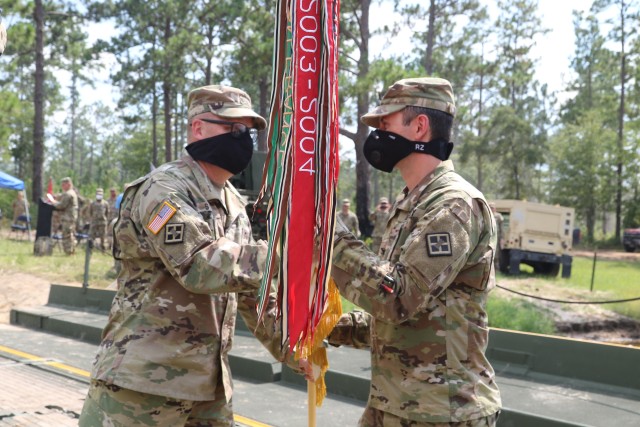 Col. Kenneth Shubert, incoming commander of the 926th Engineer Brigade, receives the brigade’s colors from Maj. Gen. Stephen Strand, the commanding general of the 412th Theater Engineer Command, during the 926th’s change of command ceremony,...