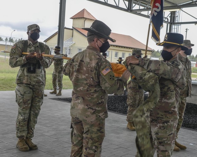 2nd Armored Brigade Combat Team, 1st Cavalry Division's Commander Col. Jeremy Wilson and Command Sgt. Maj. Alexander Yazzie, case the brigade colors during an official transfer of authority, July 2, 2020, in Grafenwoehr, Germany. The 2-1CD...