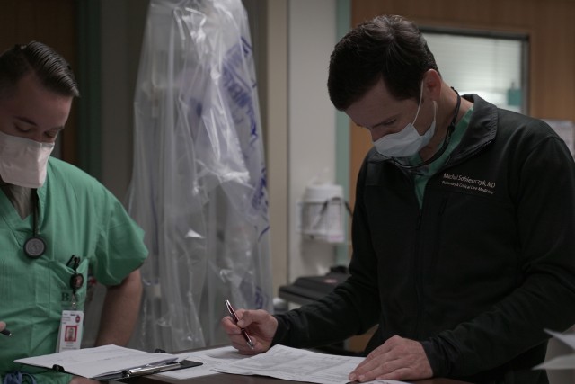 Army Maj. (Dr.) Michal Sobieszczyk, staff physician, reviews paperwork in a COVID-19 intensive care unit at Brooke Army Medical Center, Joint Base San Antonio-Fort Sam Houston, Texas, July 17, 2020.