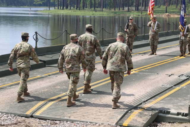 Col. Kenneth Shubert, left, incoming commander of the 926th Engineer Brigade, Maj. Gen. Stephen Strand, the commanding general of the 412th Theater Engineer Command, Col. Steven Hayden, outgoing commander of the 926th, and Command Sgt. Maj. Benny...