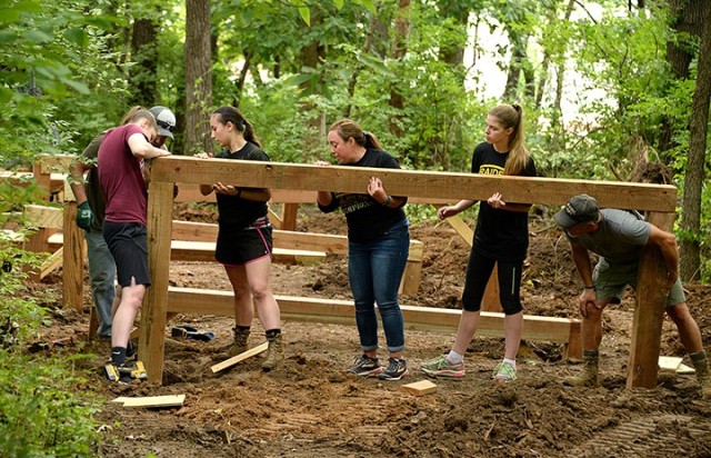 Volunteer Joe Zule, 2020 Leavenworth High School graduate Katie Zule, LHS senior Junior ROTC Cadet Capt. Madison Knapp, JROTC Coach Mary Schwartz, LHS senior JROTC Cadet 1st Lt. Amelia Rieper and volunteer Jerry Sanders position and help hold an...