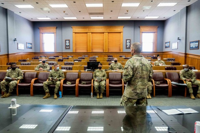 Soldiers give feedback to Sgt. Maj. of the Army Michael Grinston about a new app during a visit to Fort Leavenworth, Kans., Aug. 12, 2020. The Soldiers tested the developing app, which will help maintain training records. 