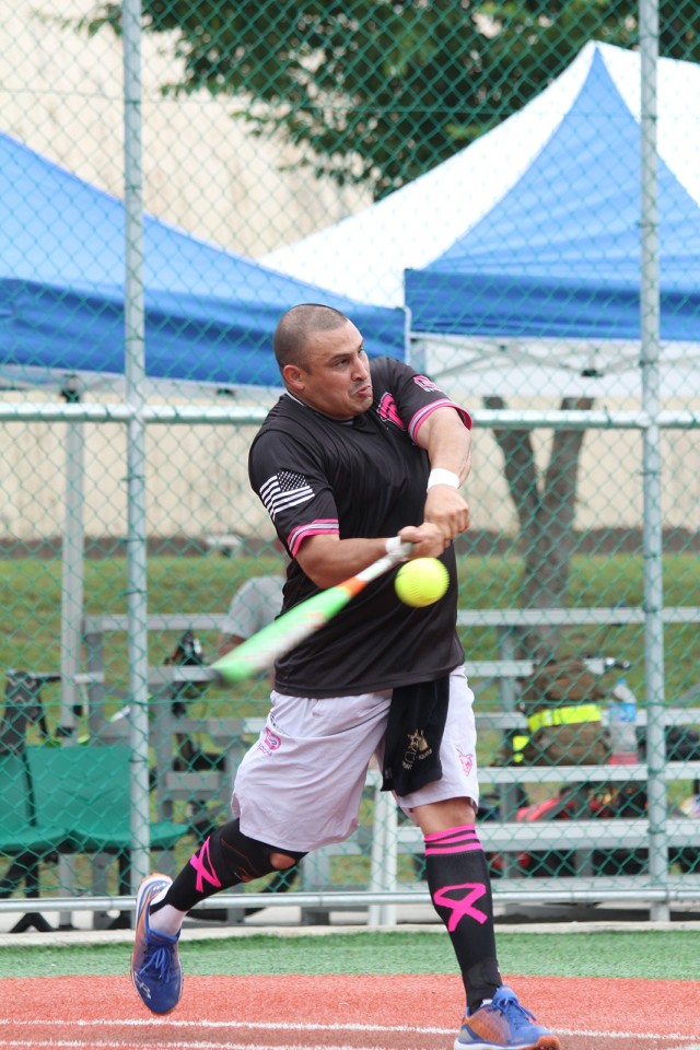 Staff Sgt. Ricardo Albarran, 2nd Battalion, 4th Field Artillery, displays an unusual batting style as he eyes the ball’s destination instead of looking at the ball as he makes contact. Regardless, Albarran solidly struck the sphere launching a...