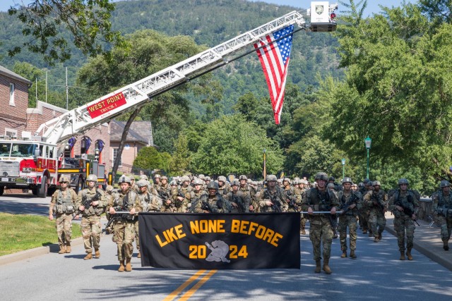Members of the U.S. Military Academy Class of 2024 proudly display their motto as they complete the final leg of a nine-mile road march signifying the successful completion of Cadet Basic Training, Aug. 10, 2020. The annual March Back followed a different route this year as 1,099 new cadets rucked mostly on post before finishing in front of Quarters 100, where they were greeted by the CBT cadet leadership. (U.S. Army photo by Tarnish Pride USMA/PAO).