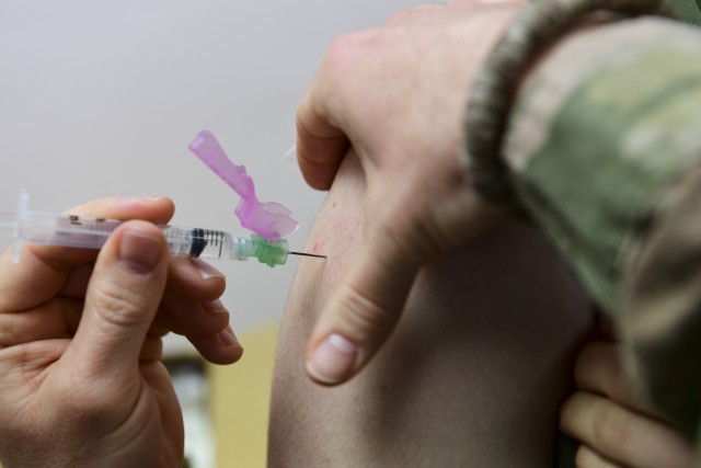 A Marine assigned to the Military Police Company B, 4th Law Enforcement Batallion recieves a vaccination at the U.S. Marine Corps Reserve Center in North Versailles, Penn., April 6, 2019. The vaccines were administered by Airmen assigned to the 911th Aeromedical Staging Squadron and are for an upcoming overseas temporary duty assignment. 