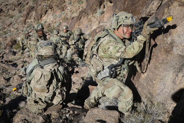U.S Army soldiers assigned to 1st Armored Brigade Combat Team, 3rd Infantry Division, Fort Stewart, Ga., scan for forces during Decisive Action Rotation 20-04 at the national Training Center (NTC), Fort Irwin, Calif., Feb. 15, 2020. Decisive Action Rotations at the National Training Center ensure Army Brigade Combat Teams remain versatile, responsive and consistently available for current and future contingencies. (U.S. Army photo by Spc. Brooke Davis, Operations Group, National Training Center)