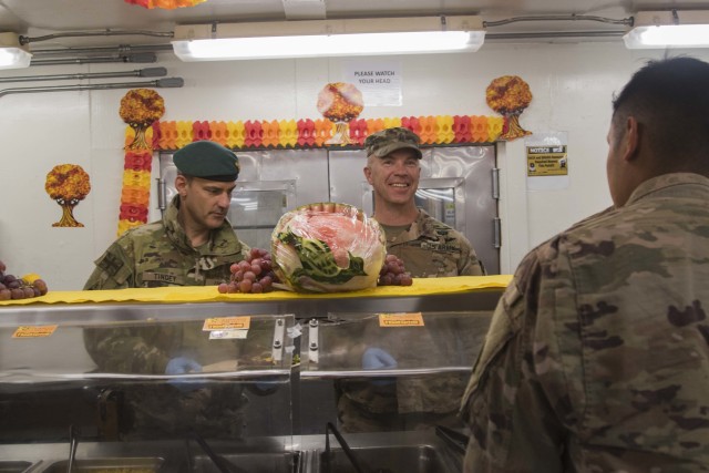 UK Army Brigadier Leigh R. Tingey, Commanding General, Task Force-Southeast and Deputy Commanding General, 1st Armored Division-Maneuver, and U.S. Army Command Sgt. Major Michael R. Kelly, Senior Enlisted Leader, Task Force-Southeast and Battalion...