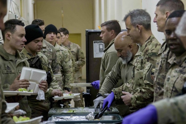 UK Army Brigadier Leigh R. Tingey, Commanding General, Task Force-Southeast and Deputy Commanding General-Maneuver, 1st Armored Division, serves Thanksgiving meals to Soldiers assigned in the Task Force-Southeast region in Southeastern Afghanistan Nov. 28, 2019. For many of the Soldiers located in these remote operating bases, this was the first hot meal in recent weeks. The practice of senior leaders serving holiday meals to Soldiers is a long-standing military tradition. (U.S. Army photo by Sgt. Nicholas Brown-Bell)