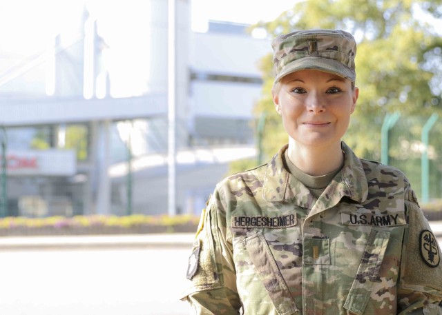 U.S. Army 2nd Lt. Stephanie Hergesheimer, a medical surgical nurse at Landstuhl Regional Medical Center, poses for a photograph in front of LRMC, Aug. 12. At a young age, the Vernon, Connecticut native entered foster care, finding herself in 33...