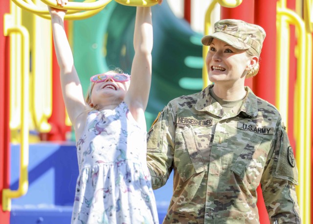 U.S. Army 2nd Lt. Stephanie Hergesheimer, a medical surgical nurse at Landstuhl Regional Medical Center, plays with her six-year-old daughter, who Hergesheimer wishes to be an inspiration for. At a young age, the Vernon, Connecticut native entered foster care due to her mother terminating parental rights and an imprisoned father. Over the span of 15 years, Hergesheimer found herself bouncing from foster family to foster family, living in a total of 33 foster homes.