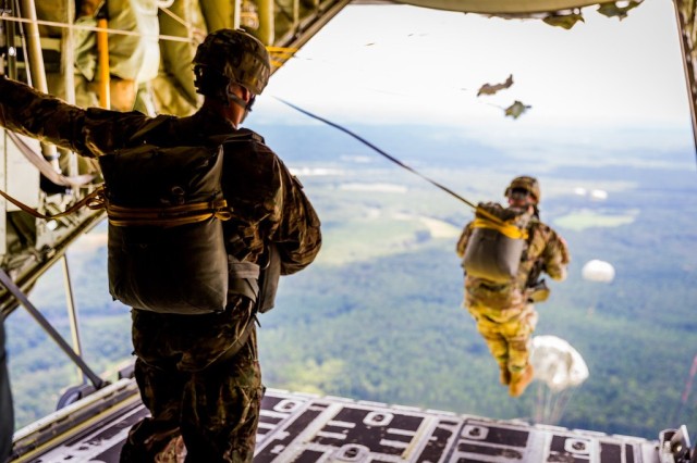 
FORT BENNING, Ga. – Over Fryar Drop Zone at Fort Benning in August 2016, U.S. Army paratroopers exit the rear of a C-130 aircraft. Fort Benning is birthplace of the U.S. Army Airborne, and home to the U.S. Army Airborne School, which trains paratroopers for the Army and other services. Aug. 16 is National Airborne Day, established in 2001 by President George W. Bush to commemorate a series of test parachute jumps that were completed Aug. 16, 1940 by the U.S. Army Parachute Test Platoon, leading to formation of the Army&#39;s Airborne units that fought in World War II.

 (U.S. Army photo by Capt. Ken Woods)
