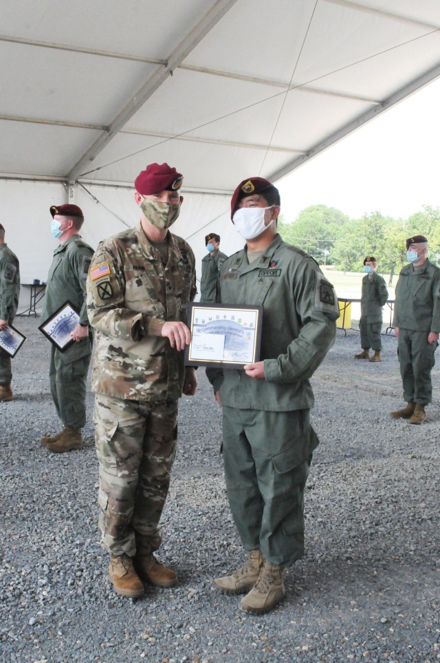 Brig. Gen. Patrick D. Frank, Joint Readiness Training Center and Fort Polk commanding general (left), presents the Commanding General's Certificate of Achievement to Sgt. Keegan Reeves, 509th Inf Reg line medic and squad leader, at an award...