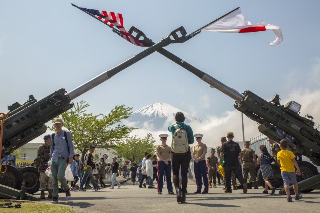 Mount Fuji watches over the Fuji Friendship Festival May 7 aboard Combined Arms Training Center Fuji, Gotemba, Japan. The festival included fun and games for all ages, such as bounce houses, face painting and live music from local artists and the U.S. 7th Fleet Band’s Orient Express. The festival also had numerous displays of weapon systems along with aircraft and vehicles. Among them were Japanese tanks, a UH60 Black Hawk and the MV-22B Osprey.