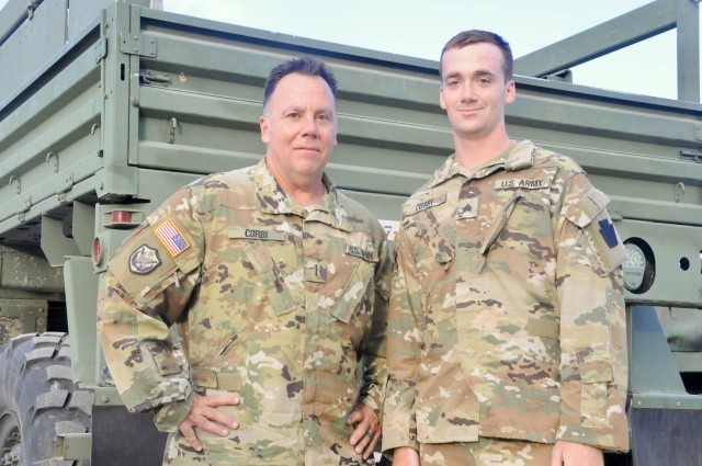 Deployed father and son promoted together