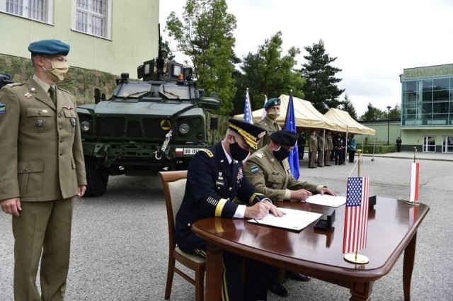 The U.S. Army Chief of Staff Gen. James C. McConville signs a Strategic Vision Statement alongside Polish military personnel August 4, 2020. The SVS outlines the U.S.' commitment to increase the already strong-level of interoperability and combined capabilities between the Polish and U.S. Armies. (Photo courtesy of the office of the U.S. Army Chief of Staff)