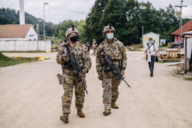 U.S Army military police soldiers assigned to the 554th MP Company, 709th MP Battalion, 18th MP Brigade patrol the streets of a notional city while supporting the 173rd Airborne Brigade during Exercise Saber Junction 20 in Hohenfels Training Area,...