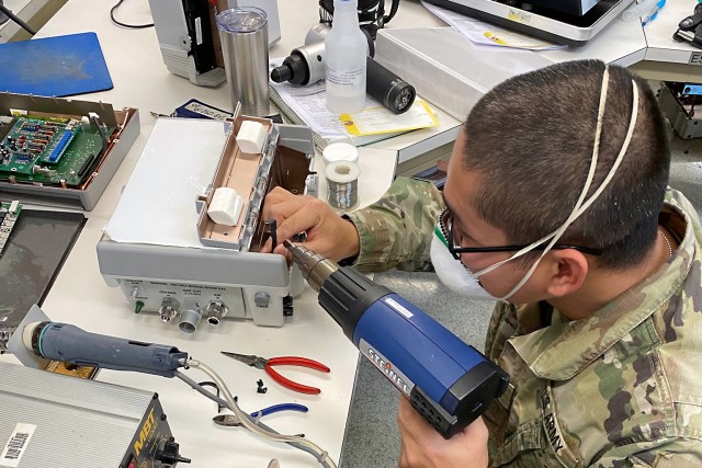 Spc. Nguyenquanghu Phan repairs a ventilator at the U.S. Army Medical Materiel Agency’s Medical Maintenance Operations Division at Tobyhanna Army Depot in Pennsylvania during a recent deployment. Phan and eight other Soldiers from the 6th...