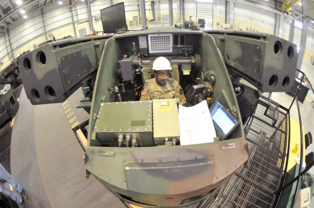 An unidentified Soldier sits in the turret of an Avenger short range air defense system vehicle during training Aug. 12.