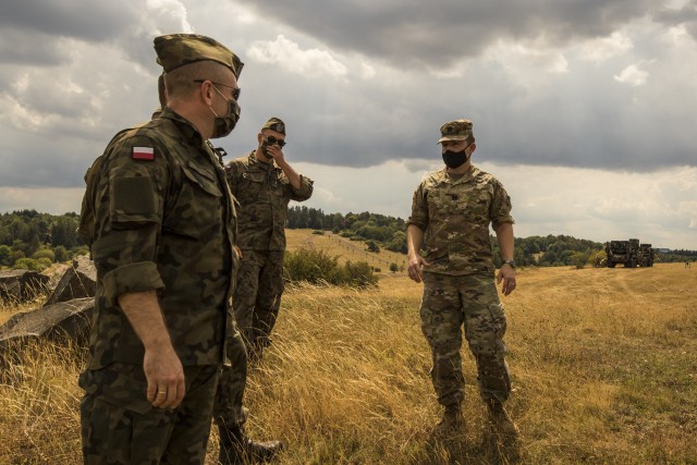 A Polish delegation, assigned to the 37th Air Defense Squadron, visits with U.S. Soldiers assigned to the 10th Army Air and Missile Defense Command on August 4, 2020 in Baumholder, Germany. The purpose of the visit was to familiarize the Polish soldiers with the patriot missile system and the Table VIII Gunnery qualification.