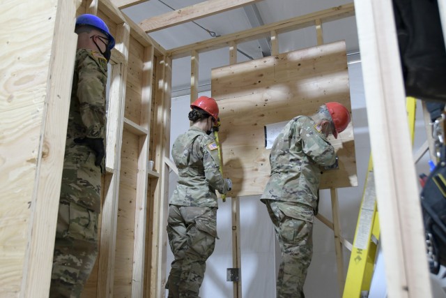 Inaugural 12R Interior Electrician military occupational skills course at Fort Hunter Liggett TASS Training Center, California, August 2020. Instructor Sgt. 1st Class Christopher Knecht with the 1st Brigade, 102nd Training Division observing (L-R)...