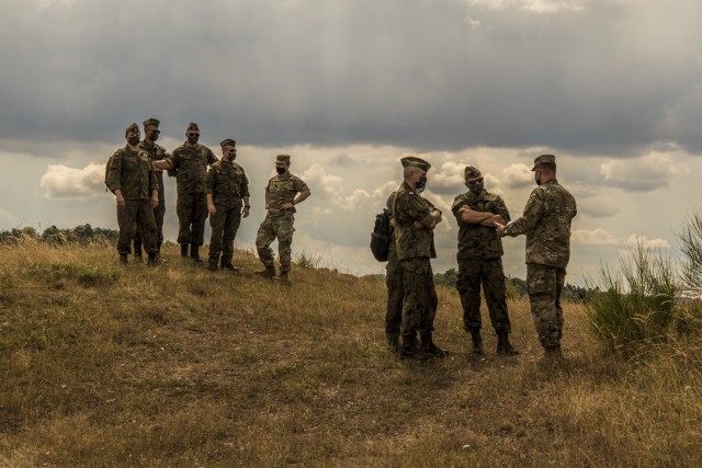 A Polish delegation, assigned to the 37th Air Defense Squadron, visits with U.S. Soldiers assigned to the 10th Army Air and Missile Defense Command on August 4, 2020 in Baumholder, Germany. The purpose of the visit was to familiarize the Polish soldiers with the patriot missile system and the Table VIII Gunnery table.