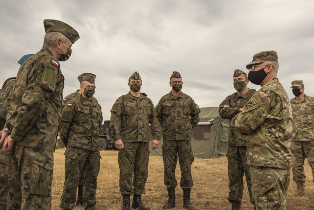 A Polish delegation, assigned to the 37th Air Defense Squadron, visits with U.S. Soldiers assigned to the 10th Army Air and Missile Defense Command on August 4, 2020 in Baumholder, Germany. The purpose of the visit was to familiarize the Polish soldiers with the patriot missile system and the Table VIII Gunnery qualification.