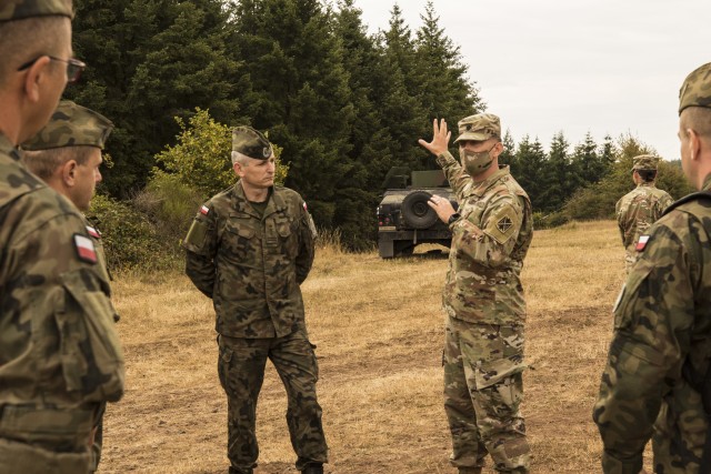 Lt. Col. Justin Logan, Commander of the 5th Battalion, 7th Air Defense Artillery Regiment, 10th Army Air and Missile Defense Command, briefs a Polish delegation, assigned to the 37th Air Defense Squadron on August 4, 2020 in Baumholder, Germany. The purpose of the visit was to familiarize the Polish soldiers with the patriot missile system and the Table VIII Gunnery qualification.