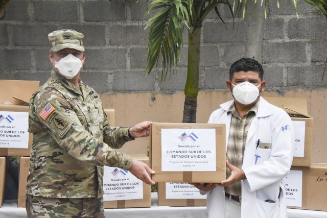 U.S. Army Col. John Litchfield, Joint Task Force-Bravo commander, poses for a photo with Dr. Daniel Mairena, deputy director of the Roberto Suazo Cordova Hospital in La Paz, Honduras, Aug. 11, 2020. The donation was part of four different...