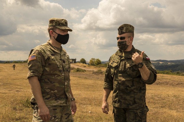 A Polish delegation, assigned to the 37th Air Defense Squadron, visits with U.S. Soldiers assigned to the 10th Army Air and Missile Defense Command on August 4, 2020 in Baumholder, Germany. The purpose of the visit was to familiarize the Polish soldiers with the patriot missile system and the Table VIII Gunnery qualification.