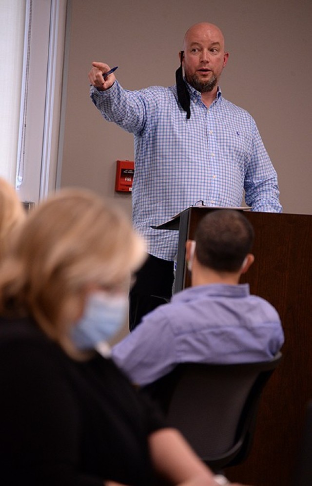 Fort Leavenworth-Unified School District 207 tabletop exercise facilitator Don Black, Fort Leavenworth Garrison emergency manager, points toward a few exercise participants in uniform, noting that service members' concern for civilian health is...