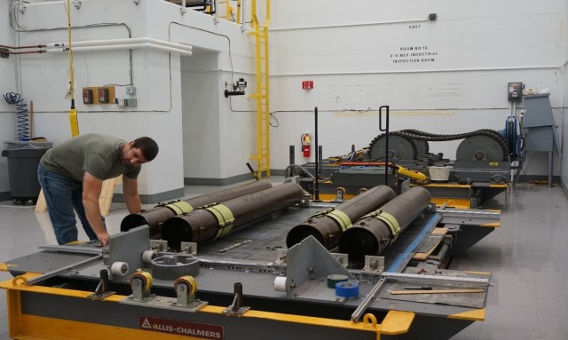 LEMC employee Nathan Hoover preparing M26 Rocket Motors for testing.  

