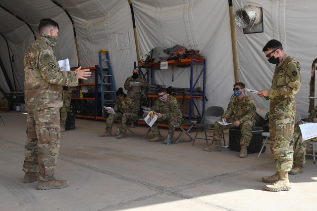ARIFJAN, Kuwait—Capt. Jason Brandle, Task Force Spartan Shield director of the personnel recovery coordination cell, provides updated personnel recovery training to flight crews assigned to the 1st Battalion, 189th General Support Aviation...