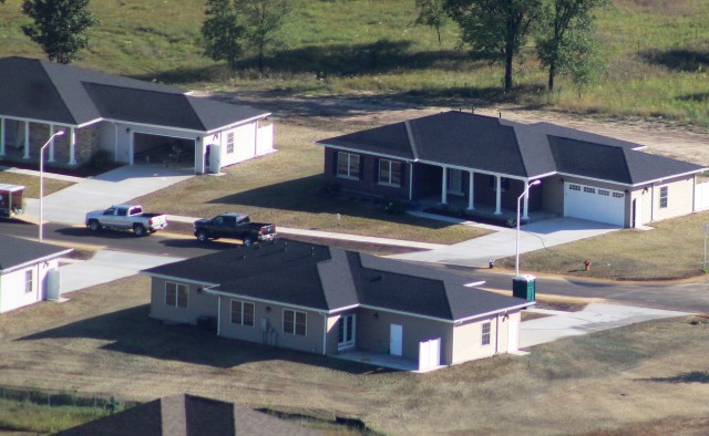 Workers with contractor Relyant Global LLC of Maryville, Tenn., continue work on a U.S. Army Corps of Engineers-led project Aug. 4, 2020, to build seven new military family housing units at the South Post Housing area in this aerial view at Fort...
