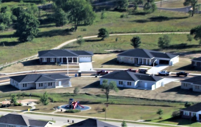 Workers with contractor Relyant Global LLC of Maryville, Tenn., continue work on a U.S. Army Corps of Engineers-led project Aug. 4, 2020, to build seven new military family housing units at the South Post Housing area in this aerial view at Fort...