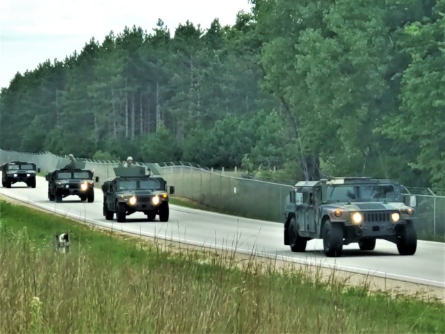 Soldiers drive military vehicles in a convoy as part of training operations Aug. 20, 2020, at Fort McCoy, Wis. During August 2020, thousands of service members were at Fort McCoy for training, including Army Reserve units and Soldiers, National Guard units and Soldiers, ROTC cadets and training staff, and more. Transient troop training like this resumed at Fort McCoy in July 2020 after being stopped for several months because of the COVID-19 pandemic response. Over months of planning, however, Fort McCoy training officials were able to reopen the training with COVID-19 safety measures built in. Fort McCoy’s motto is to be the “Total Force Training Center.” (U.S. Army Photo by Scott T. Sturkol, Public Affairs Office, Fort McCoy, Wis.)