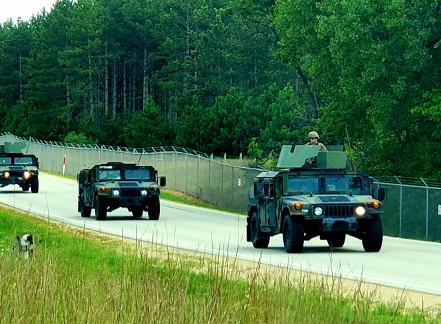 Soldiers drive military vehicles in a convoy as part of training operations Aug. 20, 2020, at Fort McCoy, Wis. During August 2020, thousands of service members were at Fort McCoy for training, including Army Reserve units and Soldiers, National...