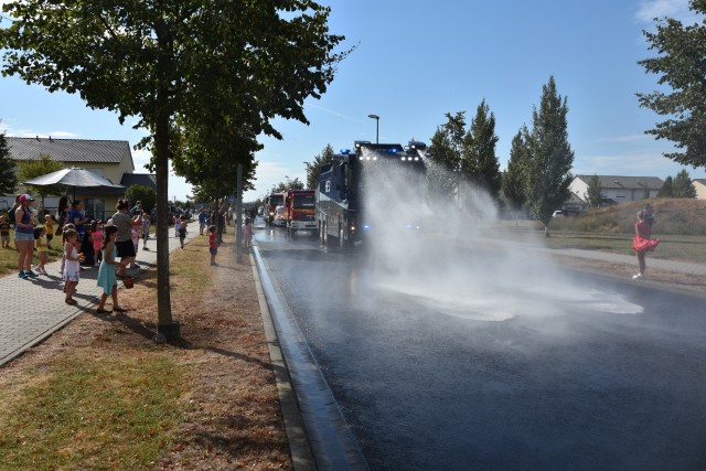 WIESBADEN, Germany – A first responder vehicle shoots water during a First Responders Day parade Aug. 21 on Clay Kaserne.