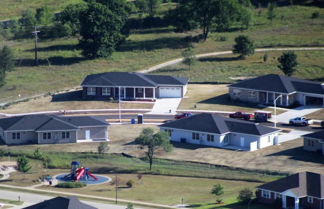 Workers with contractor Relyant Global LLC of Maryville, Tenn., continue work on a U.S. Army Corps of Engineers-led project Aug. 4, 2020, to build seven new military family housing units at the South Post Housing area in this aerial view at Fort...