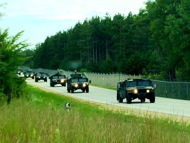 Soldiers drive military vehicles in a convoy as part of training operations Aug. 20, 2020, at Fort McCoy, Wis. During August 2020, thousands of service members were at Fort McCoy for training, including Army Reserve units and Soldiers, National Guard units and Soldiers, ROTC cadets and training staff, and more. Transient troop training like this resumed at Fort McCoy in July 2020 after being stopped for several months because of the COVID-19 pandemic response. Over months of planning, however, Fort McCoy training officials were able to reopen the training with COVID-19 safety measures built in. Fort McCoy’s motto is to be the “Total Force Training Center.” (U.S. Army Photo by Scott T. Sturkol, Public Affairs Office, Fort McCoy, Wis.)