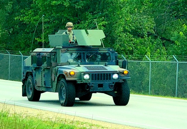 Soldiers drive a High-Mobility Multipurpose Wheeled Vehicle as part of a convoy during training operations Aug. 20, 2020, at Fort McCoy, Wis. During August 2020, thousands of service members were at Fort McCoy for training, including Army Reserve units and Soldiers, National Guard units and Soldiers, ROTC cadets and training staff, and more. Transient troop training like this resumed at Fort McCoy in July 2020 after being stopped for several months because of the COVID-19 pandemic response. Over months of planning, however, Fort McCoy training officials were able to reopen the training with COVID-19 safety measures built in. Fort McCoy’s motto is to be the “Total Force Training Center.” (U.S. Army Photo by Scott T. Sturkol, Public Affairs Office, Fort McCoy, Wis.)