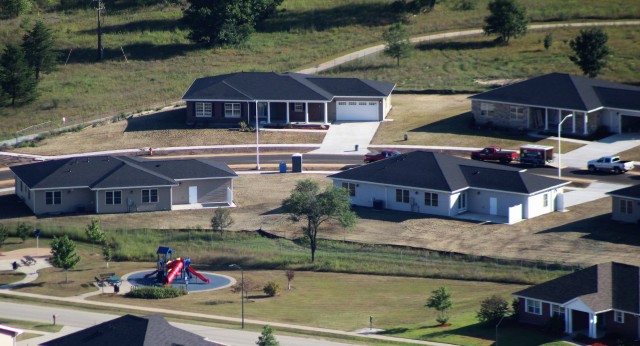 Workers with contractor Relyant Global LLC of Maryville, Tenn., continue work on a U.S. Army Corps of Engineers-led project Aug. 4, 2020, to build seven new military family housing units at the South Post Housing area in this aerial view at Fort...