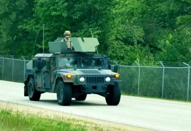 Soldiers drive a High-Mobility Multipurpose Wheeled Vehicle as part of a convoy during training operations Aug. 20, 2020, at Fort McCoy, Wis. During August 2020, thousands of service members were at Fort McCoy for training, including Army Reserve units and Soldiers, National Guard units and Soldiers, ROTC cadets and training staff, and more. Transient troop training like this resumed at Fort McCoy in July 2020 after being stopped for several months because of the COVID-19 pandemic response. Over months of planning, however, Fort McCoy training officials were able to reopen the training with COVID-19 safety measures built in. Fort McCoy’s motto is to be the “Total Force Training Center.” (U.S. Army Photo by Scott T. Sturkol, Public Affairs Office, Fort McCoy, Wis.)