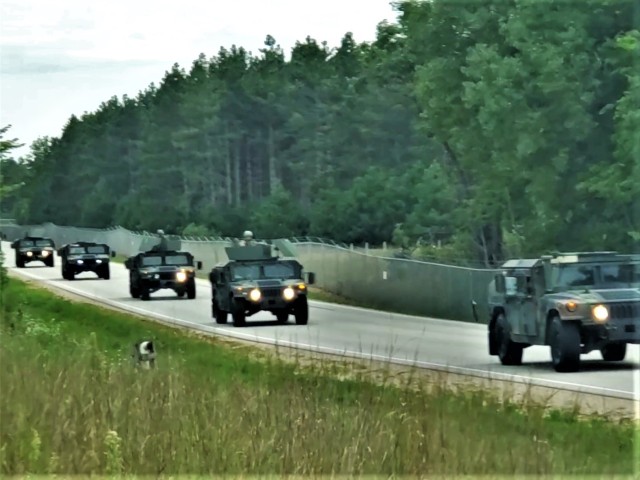 Soldiers drive military vehicles in a convoy as part of training operations Aug. 20, 2020, at Fort McCoy, Wis. During August 2020, thousands of service members were at Fort McCoy for training, including Army Reserve units and Soldiers, National Guard units and Soldiers, ROTC cadets and training staff, and more. Transient troop training like this resumed at Fort McCoy in July 2020 after being stopped for several months because of the COVID-19 pandemic response. Over months of planning, however, Fort McCoy training officials were able to reopen the training with COVID-19 safety measures built in. Fort McCoy’s motto is to be the “Total Force Training Center.” (U.S. Army Photo by Scott T. Sturkol, Public Affairs Office, Fort McCoy, Wis.)