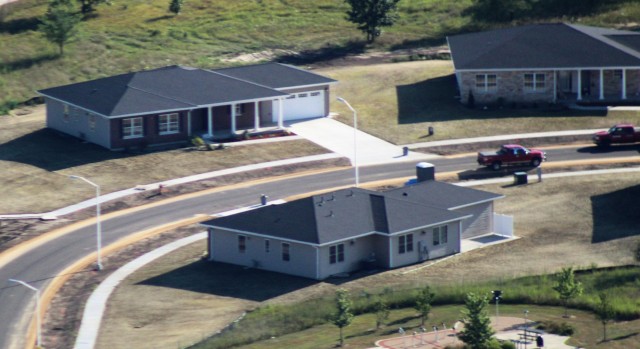 Workers with contractor Relyant Global LLC of Maryville, Tenn., continue work on a U.S. Army Corps of Engineers-led project Aug. 4, 2020, to build seven new military family housing units at the South Post Housing area in this aerial view at Fort...
