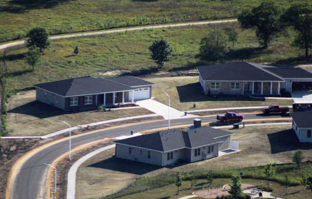 Workers with contractor Relyant Global LLC of Maryville, Tenn., continue work on a U.S. Army Corps of Engineers-led project Aug. 4, 2020, to build seven new military family housing units at the South Post Housing area in this aerial view at Fort...
