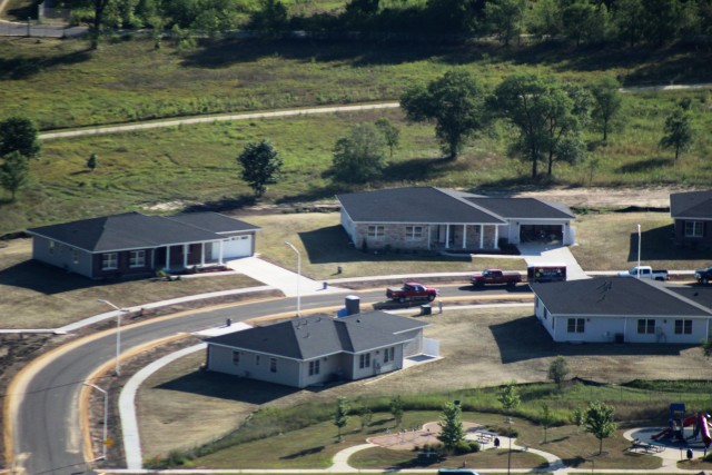 Workers with contractor Relyant Global LLC of Maryville, Tenn., continue work on a U.S. Army Corps of Engineers-led project Aug. 4, 2020, to build seven new military family housing units at the South Post Housing area in this aerial view at Fort...