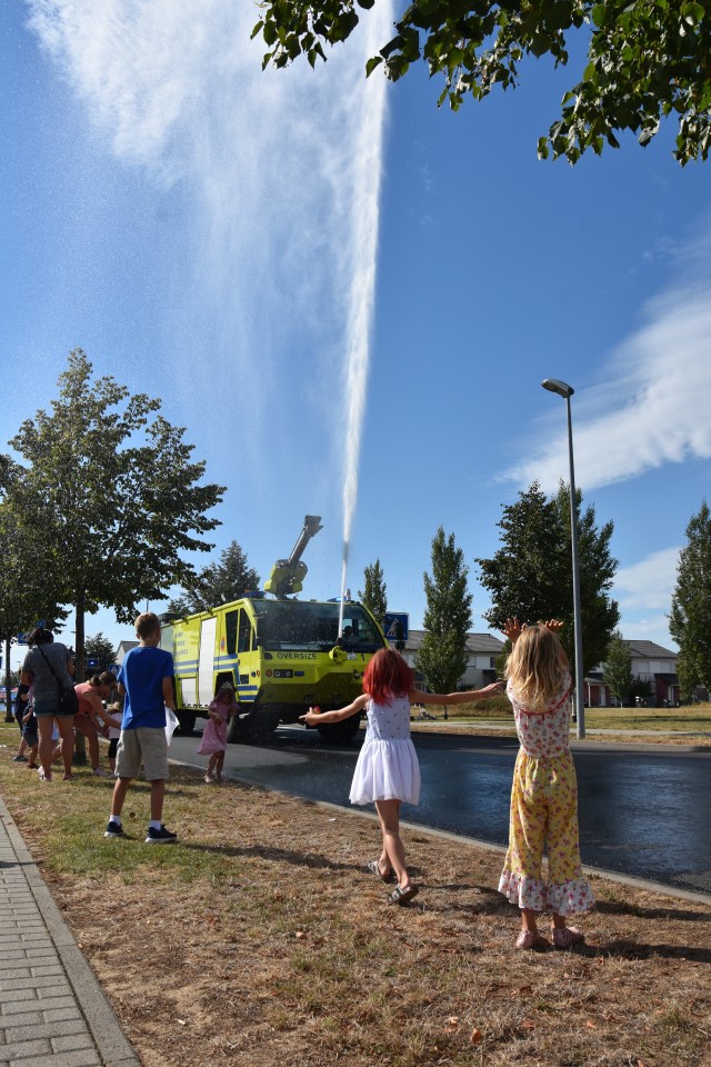 WIESBADEN, Germany – Children cheer as a fire rescue truck shoots water during a First Responders Day parade Aug. 21 on Clay Kaserne.