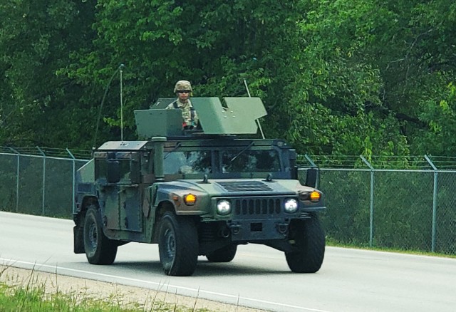 Soldiers drive a High-Mobility Multipurpose Wheeled Vehicle as part of a convoy during training operations Aug. 20, 2020, at Fort McCoy, Wis. During August 2020, thousands of service members were at Fort McCoy for training, including Army Reserve units and Soldiers, National Guard units and Soldiers, ROTC cadets and training staff, and more. Transient troop training like this resumed at Fort McCoy in July 2020 after being stopped for several months because of the COVID-19 pandemic response. Over months of planning, however, Fort McCoy training officials were able to reopen the training with COVID-19 safety measures built in. Fort McCoy’s motto is to be the “Total Force Training Center.” (U.S. Army Photo by Scott T. Sturkol, Public Affairs Office, Fort McCoy, Wis.)